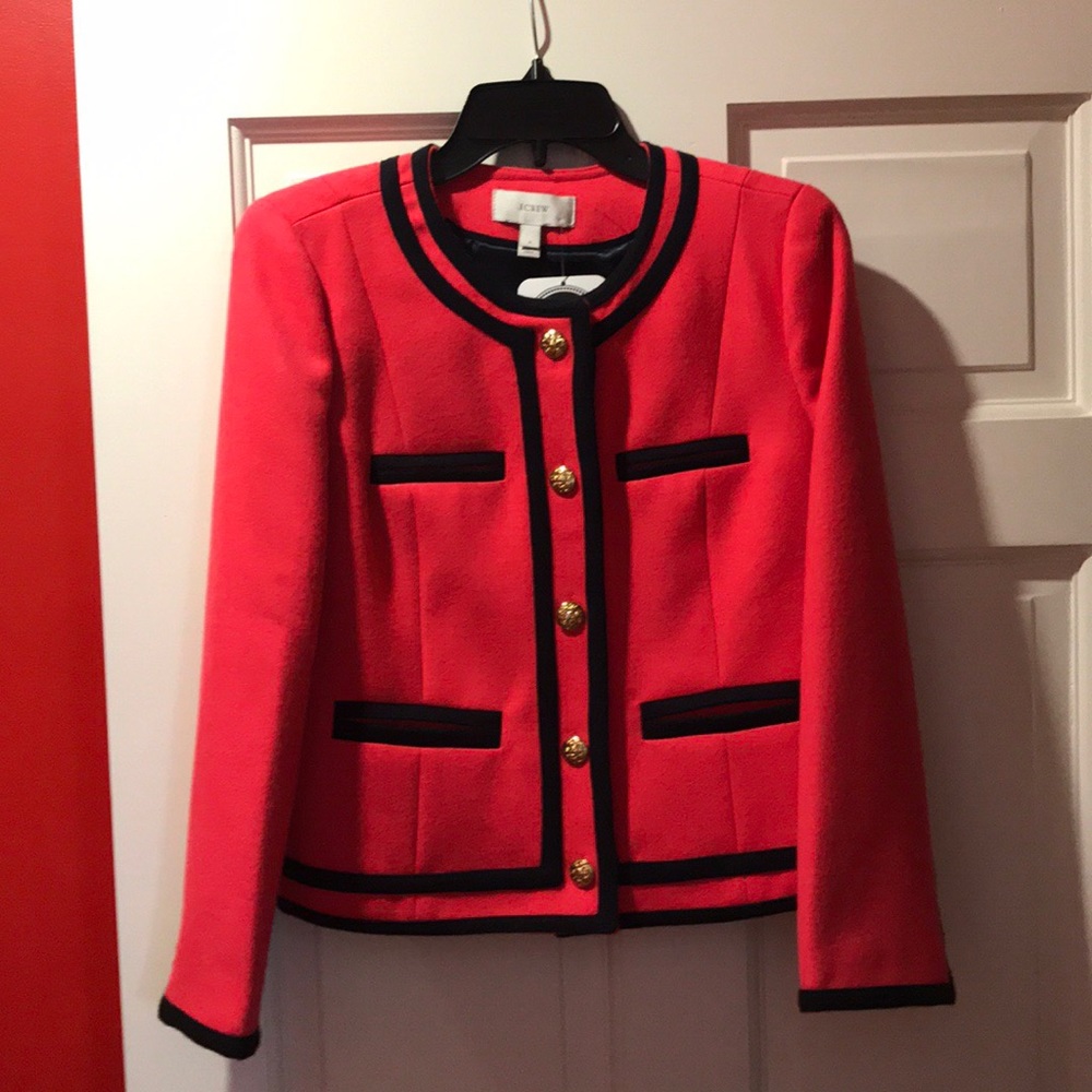 Coral wool jacket with dark blue trim/detailing